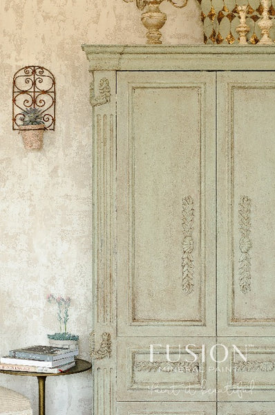Fusion Mineral Paint | Antique armoire painted with Lichen surrounded by other decor.