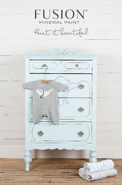 Fusion Mineral Paint | Little Whale painted dresser with baby jumper hanging off the front.