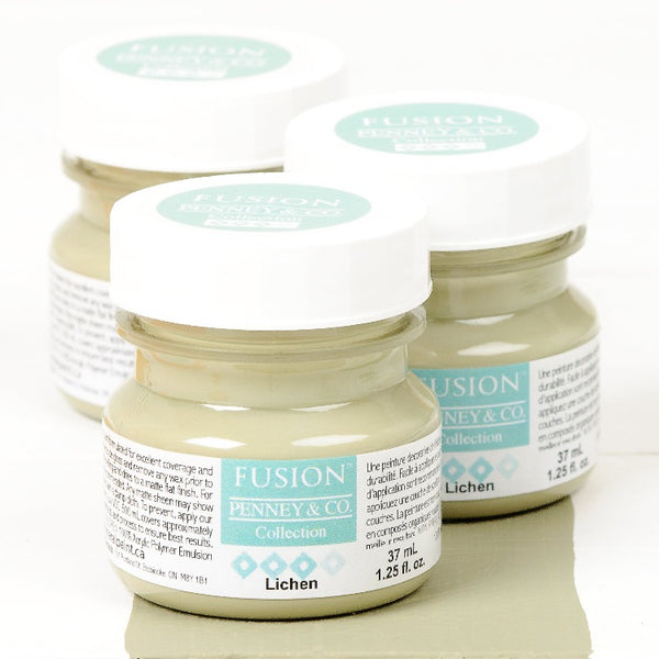 Fusion Mineral Paint | Three small jars of Lichen on a white background with a paint streak down the middle.