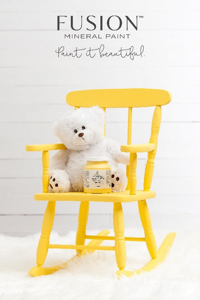 Fusion Mineral Paint | Little star painted rocking chair with small white teddy bear and a jar of Little Star wait in front of a white wall.