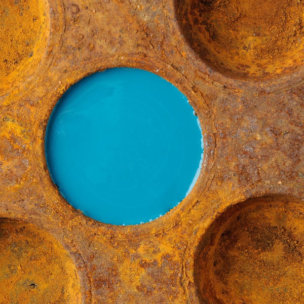Fusion Mineral Paint | Rusted tin with one hole filled with Renfrew Blue.