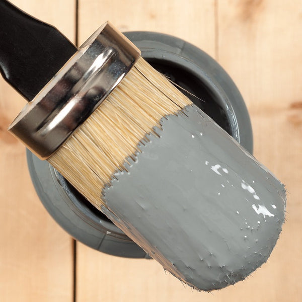 Fusion Mineral Paint | Paintbrush dipped in Soapstone sitting on top of the paint jar.