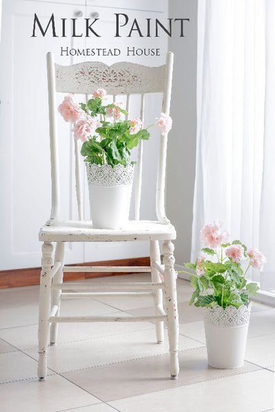 Milk Paint Homestead House | Limestone painted chair and planters in a white dining room.
